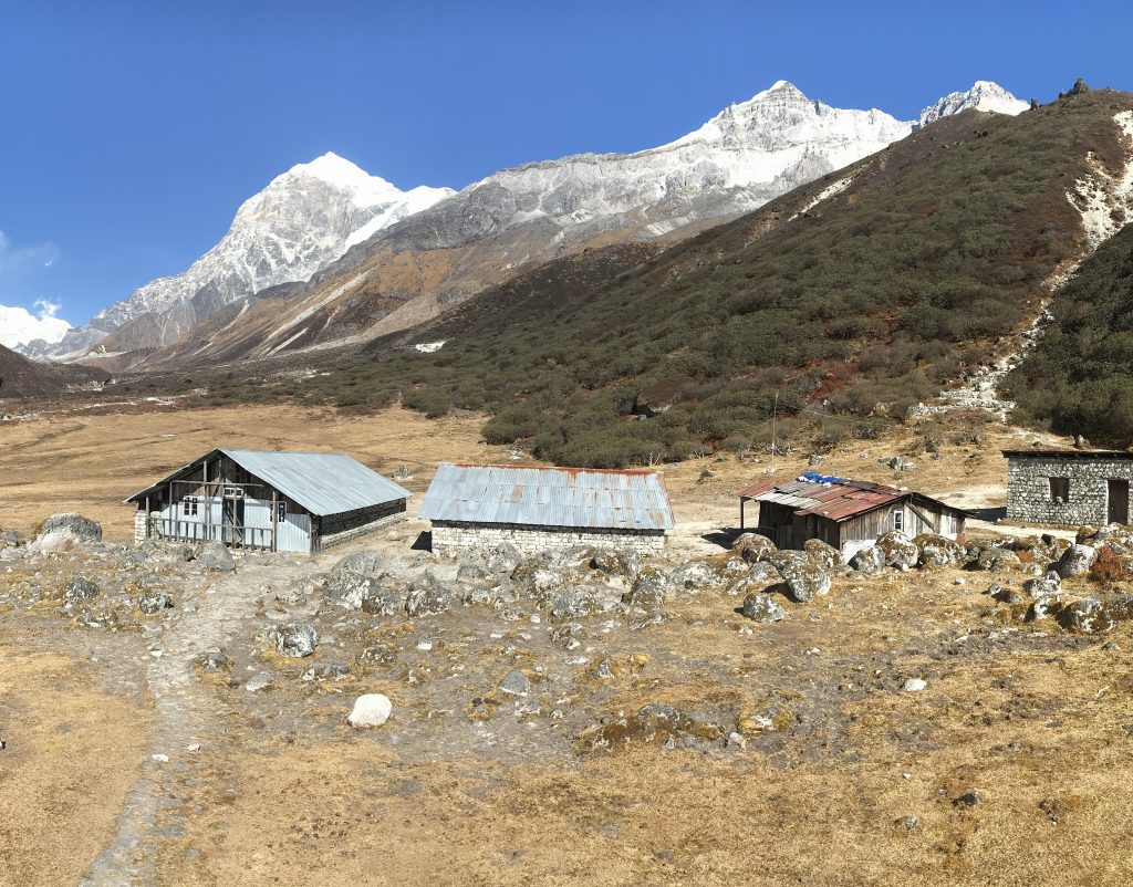 Low stone buildings with tin roofs make up the mountain camp for the snow leopard expedition