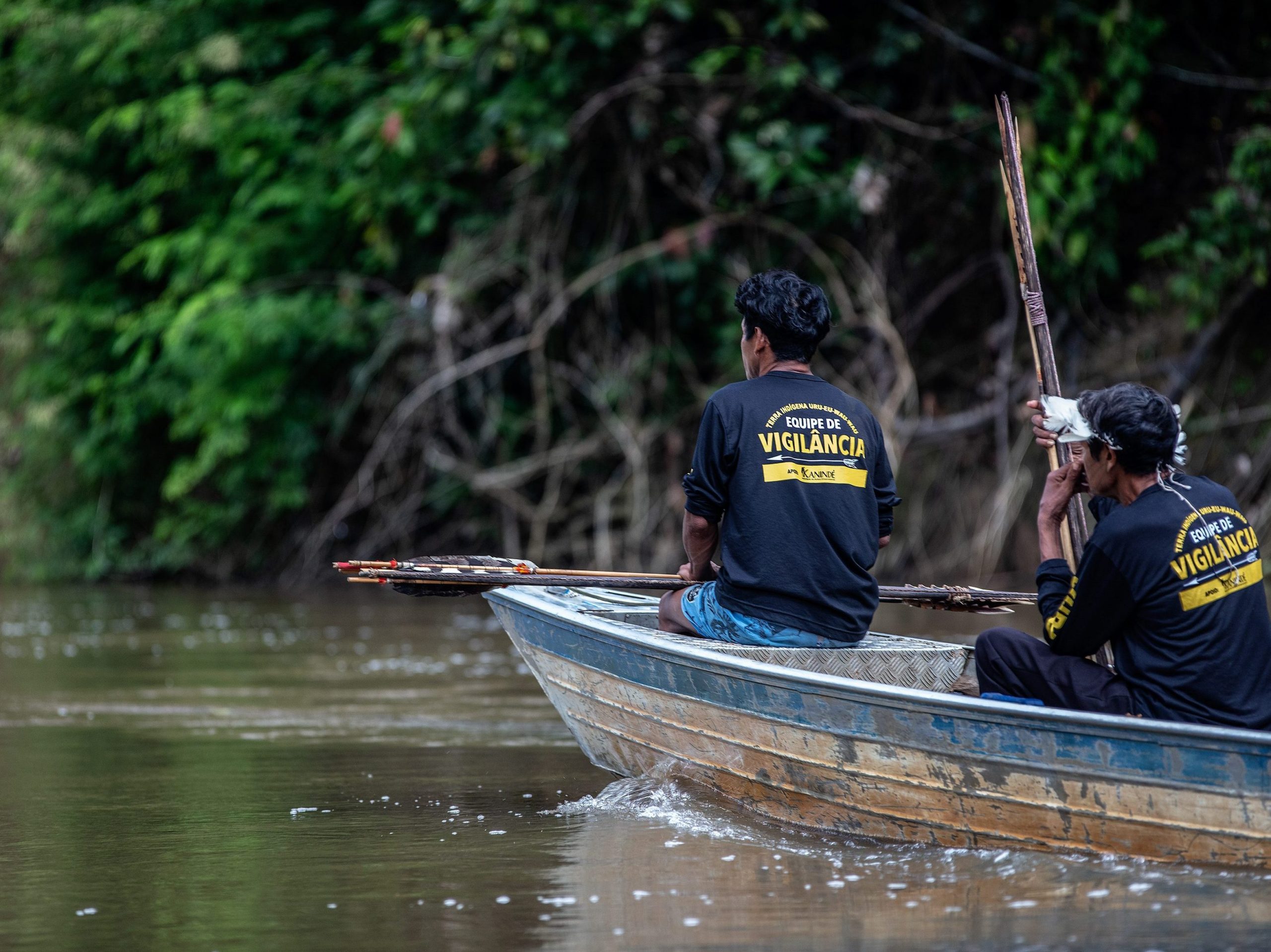 Photograph showing members of a community-led surveillance team as it patrols the Jamari river in a boat