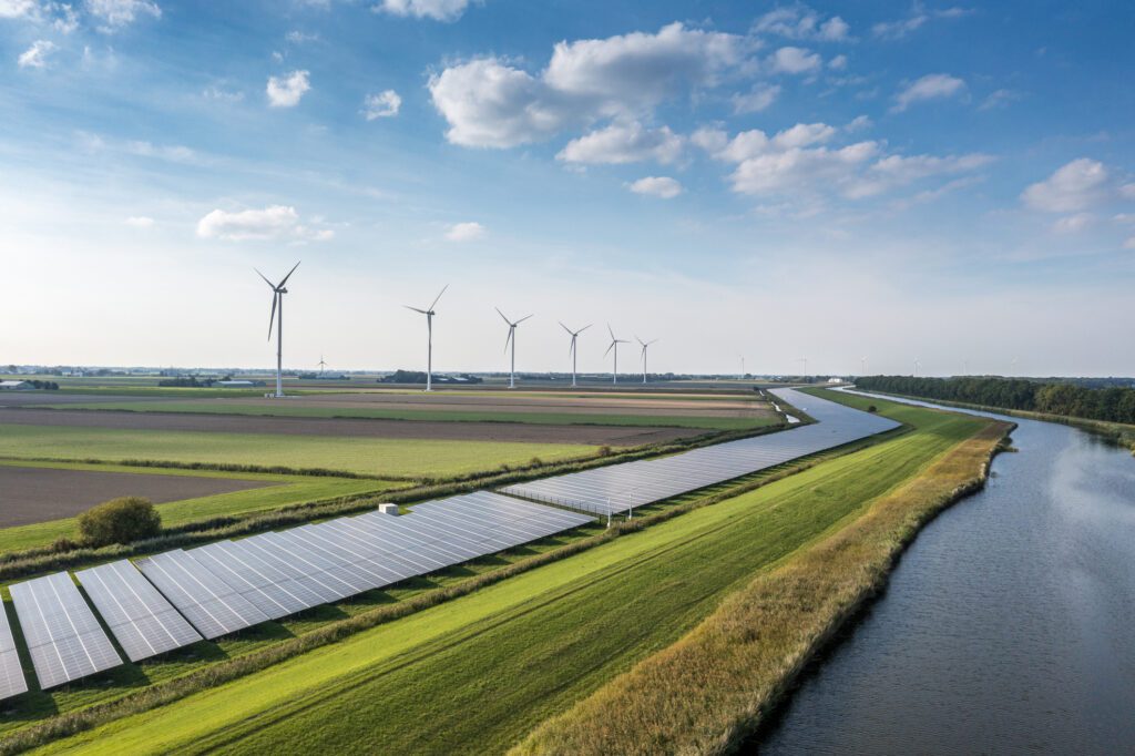 Solar panels and wind turbines generating renewable energy