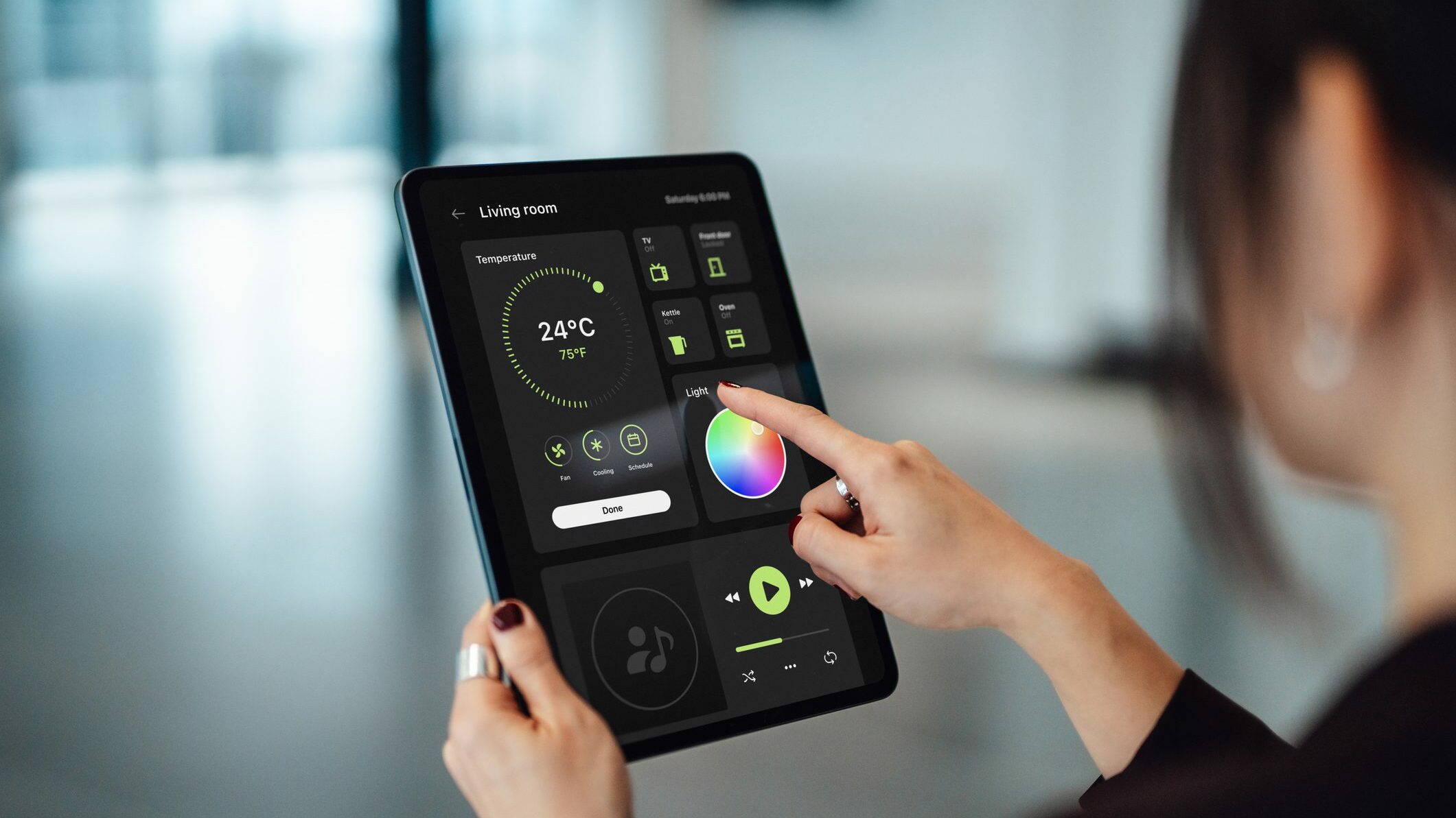 Close-up shot of a business woman hand controlling smart electronic appliances with control panel in an office. Smart technology concept. Smart living. Lifestyle and technology. Smart office dashboard - using a control panel of a modern smart office