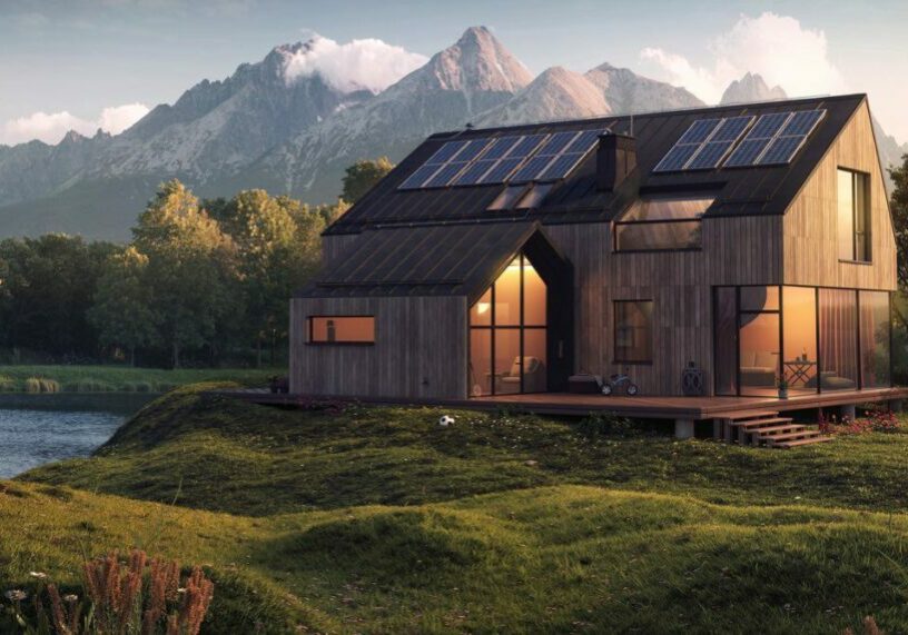 A sustainable house in front of mountains at the end of a lake
